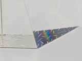 a piece of clear glass with a rainbow in it