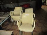 four chairs that are sitting in a row in a room