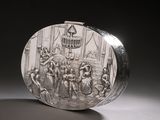 an image of a silver purse with a picture of a group of people