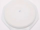a white plate with a blue and white design on it