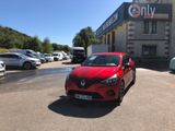 a red car parked in front of a building