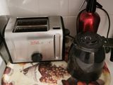 a toaster and a kettle sitting on a kitchen counter