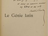 an old book with writing on it sitting on top of a table