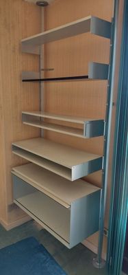 shelves in a room with a blue rug and a blue rug