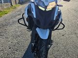 a motorcycle that is parked on the side of the road