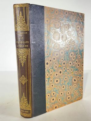 a close up of a book on a table with a white background