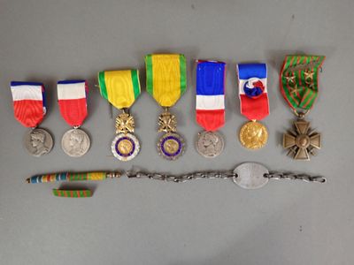 many medals and a knife on the table