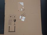 a cardboard box sitting on top of a wooden table