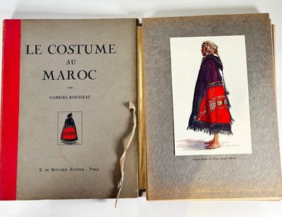 an old book with a picture of a woman in a red dress