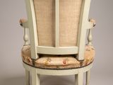 an image of a chair with a floral upholstered seat and back