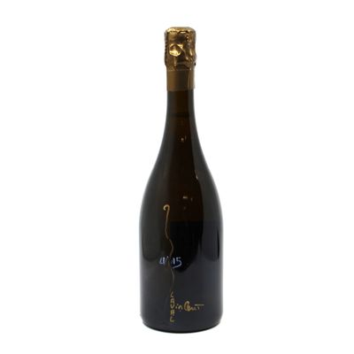 a bottle of wine that is sitting on a white surface