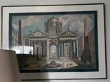a picture of a painting hanging on the wall above a lamp