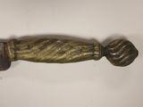 an image of a close up of a knife on a table