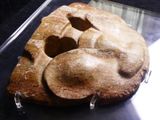 an image of a piece of bread with a face on it