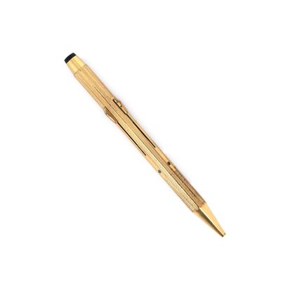 a close up of a pen on a white surface with a white background