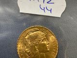 a close up of a gold coin in a plastic bag