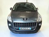 the front of a silver car with a number plate on it