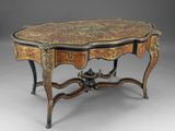 an ornately decorated table with a marble top