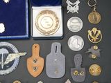 a lot of medals and other items that are on the table