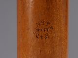 an image of a close up of a baseball bat on a table