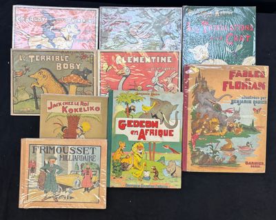 Plusieurs livres pour enfants sont alignés sur une surface noire