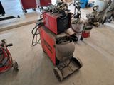 a machine that is sitting on the floor in the garage