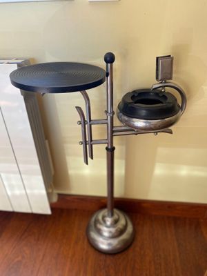 a toilet and a sink in a room with wood floors