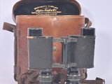 a brown bag with a pair of binoculars in it