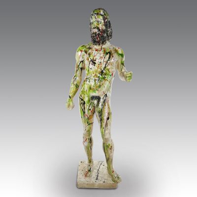 a close up of a statue of a man with paint all over his body