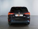 the rear end of a black car with a license plate on it