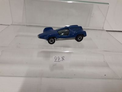 a blue toy car in a clear display case