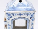 a small blue and white box with a ring inside of it