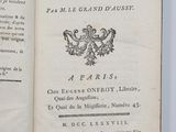 an open book with a black and white image of a coat of arms
