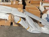 a large pile of boxes and other items in a garage