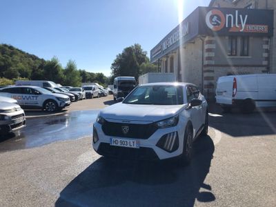 a white car that is parked in a parking lot