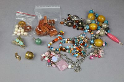 a lot of beads and charms on a table