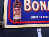 a blue sign with a bottle of booze on it