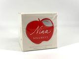 un savon en forme de pomme posé sur une boîte blanche