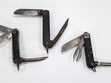 several different types of knives are arranged on a white surface