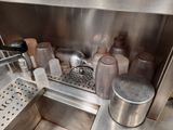 a sink that has a lot of bottles in it