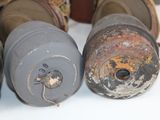 many different types of gas canisters sitting on a table