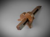 a close up of a clamp with a wooden handle