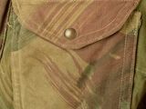 the back of a man wearing a jacket with a camouflage pattern on it