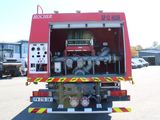 a fire truck that is parked in the parking lot
