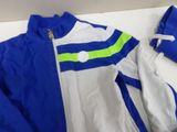 a blue and white jacket with a green stripe on it