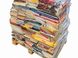 a stack of magazines on a pallet on a white background