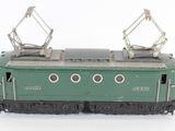 a green train on the tracks on a white background
