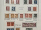 a picture of a collection of stamps on display in a glass case