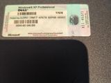a ticket sitting on top of a table next to a cell phone