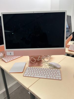 a desk with a computer, keyboard, mouse and mouse on it